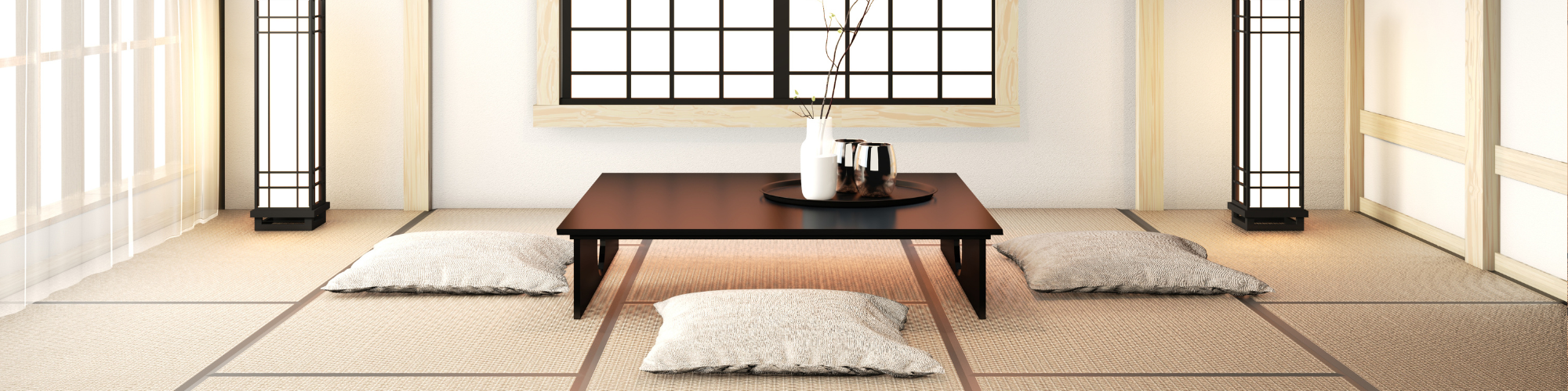 Stanza tradizionale giapponese con tatami, tavolino basso e cuscini zabuton